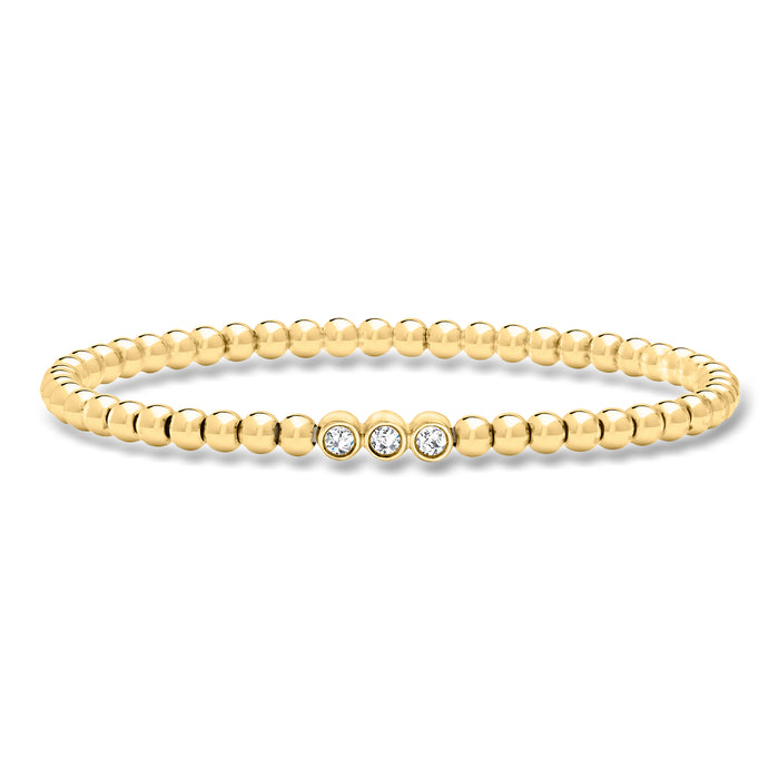 Gold bead stretch bracelet with four round lab-grown diamonds in a center row