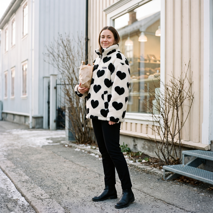 Adelfa Reversible Jacket - woman outside neighbourhood bakery, winter morning lifestyle mood