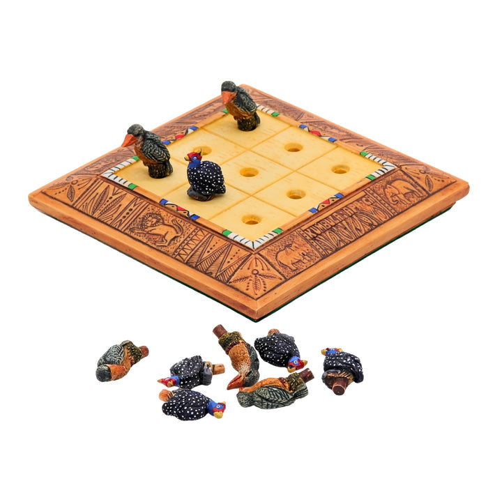 African Bird Noughts & Crosses resin game set with hand-painted birds showcasing board with slots for pieces side view