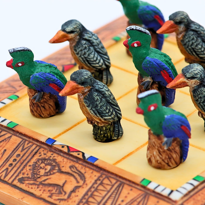 Close up of African Bird Noughts & Crosses resin game set with hand-painted birds showcasing Kingfisher & Loerie pieces