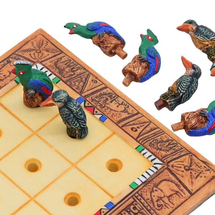 African Bird Noughts & Crosses resin game set with hand-painted birds showcasing board with slots for pieces