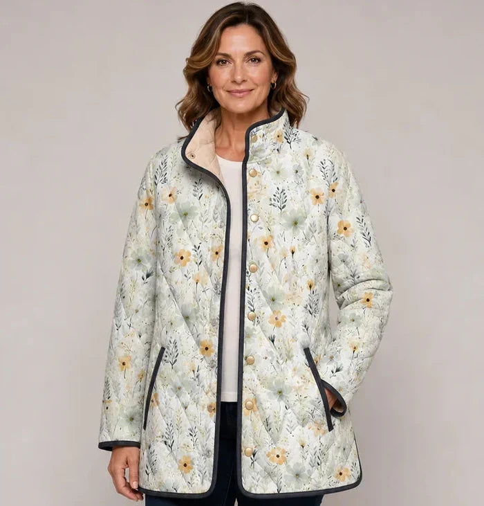 EMMA Aili quilted jacket in pale ditsy floral print, worn by a model