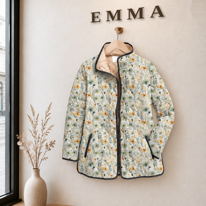 EMMA Aili quilted jacket in pale ditsy floral print, on a hanger in the EMMA boutique
