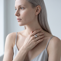 Model wearing the Ansa silver sculptural hug ring on her index finger