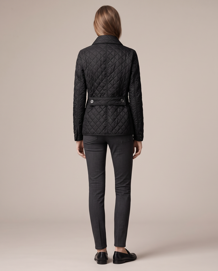 Astrid diamond-quilted jacket with contrast lining in black, back view showing quilting across the back panel