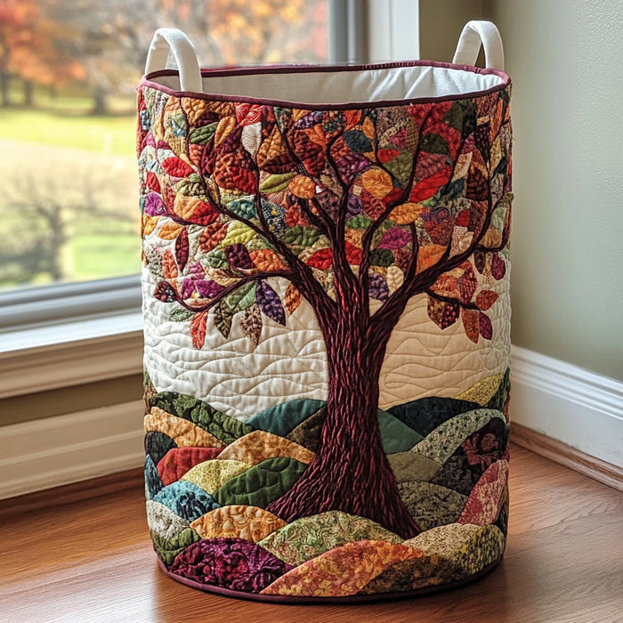 Quilted laundry basket with an autumn tree on patchwork fields