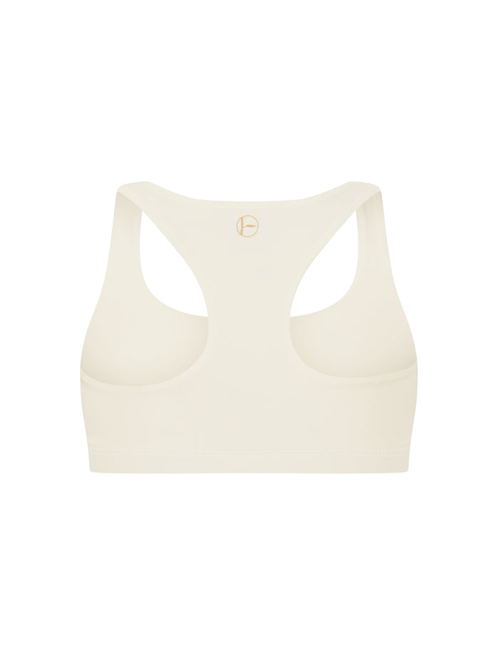 Cream sports bra on a white background