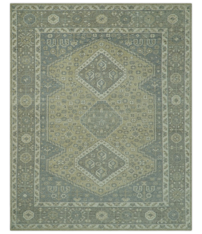 Traditional Turkish hand-knotted wool rug, sage green with cream central medallion and border