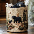 Quilted laundry basket with a black bear and cub walking through pines