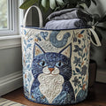 Quilted laundry basket with a blue folk-art cat and scrolling leaves