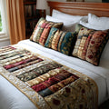 Quilted bed runner printed with a row of leather-bound books