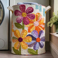 Quilted laundry basket with large overlapping daisies in violet and coral