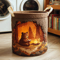 Quilted laundry basket with a bear beside a campfire in a cave