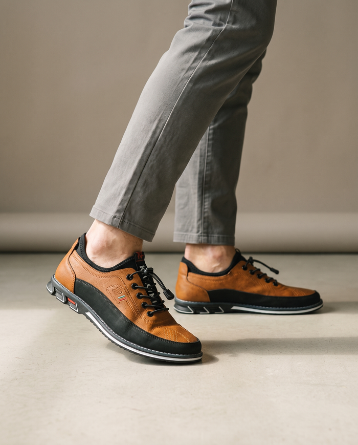 Tan casual leather shoes worn on model