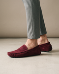 Burgundy casual suede loafers worn on model
