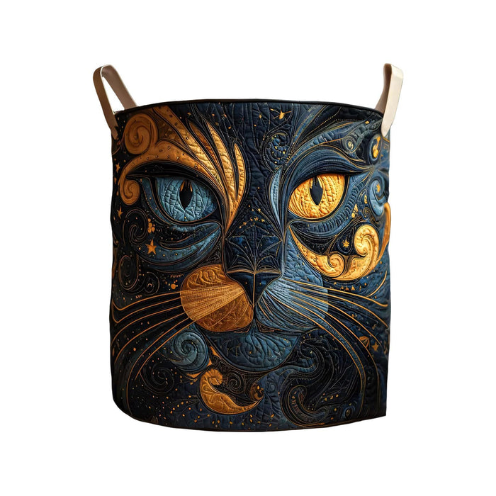 Quilted laundry basket with a swirling gold and midnight blue cat face