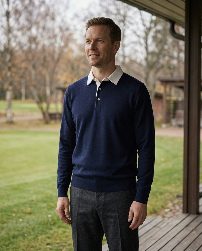 Navy contrast-collar polo jumper worn on a terrace in autumn