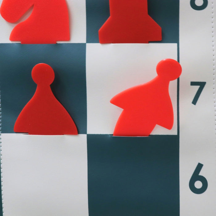 Demonstration chess set stick-in pieces inserted into pocket