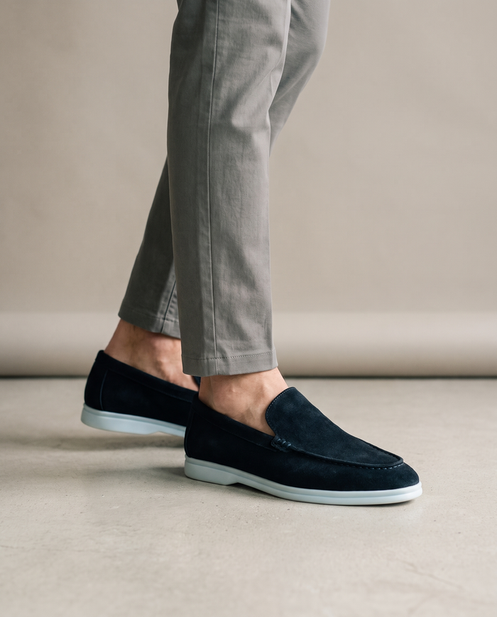 Navy elegant suede moccasins worn on model