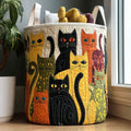 Quilted laundry basket with stacked folk-art cats in mustard and black
