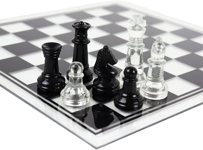 Side angle of glass chess set with a close up image of seven chess pieces