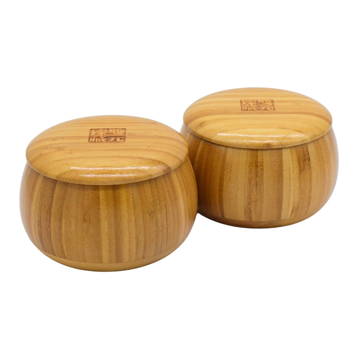 Go Bowls & Stones Set showing closed bamboo bowls containing black and white go stones