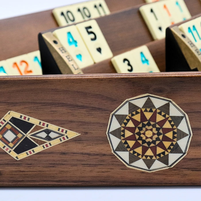 Solid beech wood Rummikub set front and back of racks showing geometric mosaic inlay detail and melamine tiles