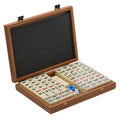 Premium mahjong tile set in walnut replica case displayed open with organised tiles