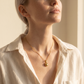 Model wearing the Maija gold-plated heart pendant necklace