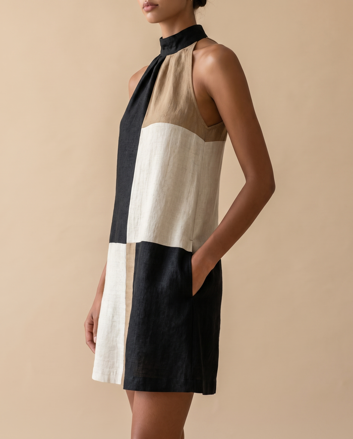 Nadia colour-block halter mini dress, three-quarter view showing A-line shape and side pocket
