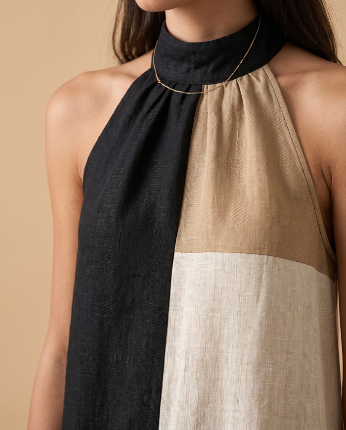 Nadia colour-block halter mini dress, close-up of halter neckline and panel seams