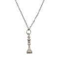Silver pendant necklace with a King chess piece charm.