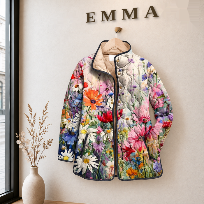 EMMA Outi quilted jacket in pale meadow floral print, on a hanger in the EMMA boutique