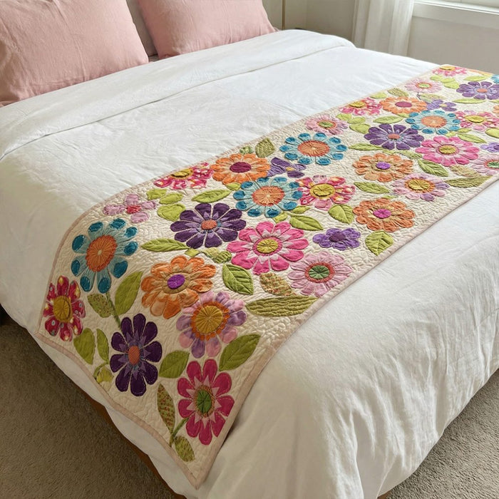 Quilted bed runner with scattered pastel daisies on off-white
