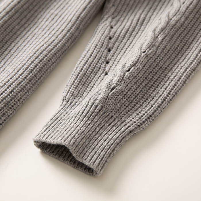 Sleeve detail of the grey cardigan showing the ribbed cuff