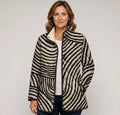 EMMA Pirkko quilted jacket in black and beige retro stripe, worn by a model