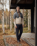 Quilted-yoke knit jumper worn on a Nordic cabin porch in autumn
