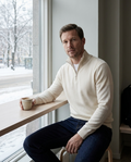 Cream quarter-zip jumper worn in a Helsinki cafe in winter