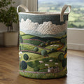Quilted laundry basket with rolling green hills and sheep