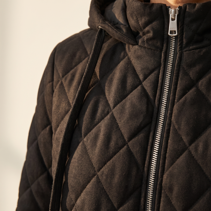 Close-up of the Routa jacket, showing the diamond quilting, brushed surface and zip