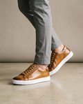 Saint-Tropez tan leather sneakers worn on model