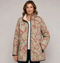 EMMA Sirkku quilted jacket in blush vintage floral print, worn by a model