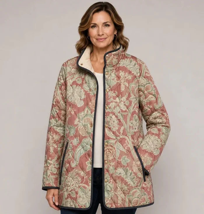 EMMA Sirkku quilted jacket in blush vintage floral print, worn by a model