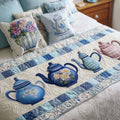 Quilted bed runner with blue and white teapots and roses