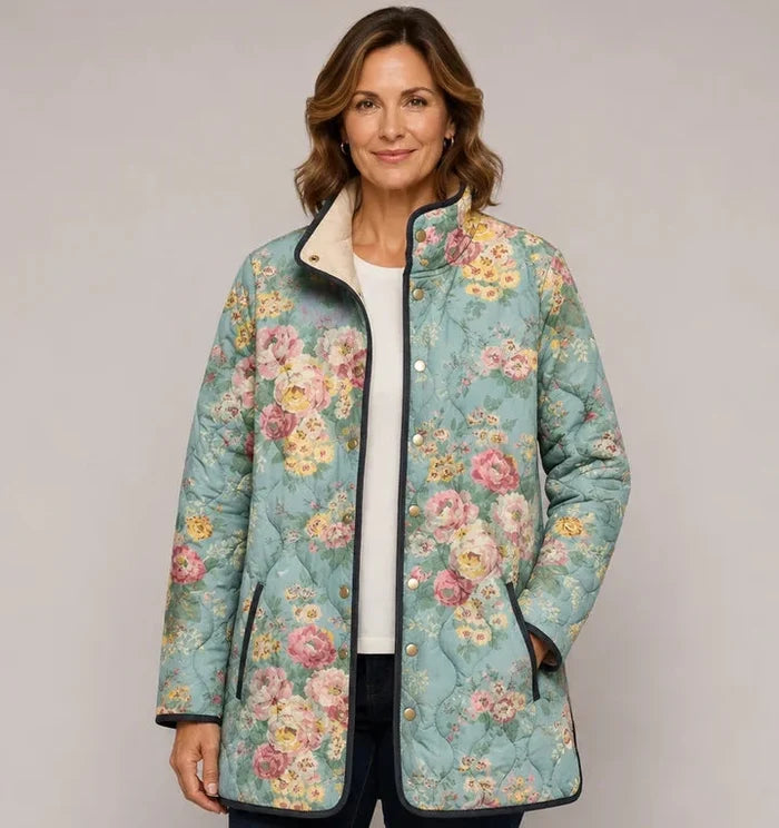 EMMA Tuulikki quilted jacket in mint green rose print, worn by a model