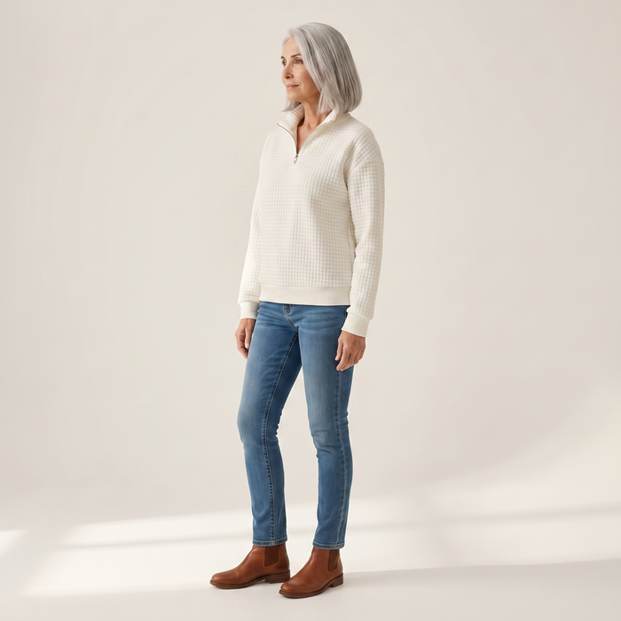 Usva waffle-knit sweatshirt seen from the side, showing the dropped shoulder and stand collar
