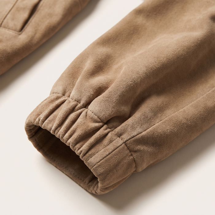 Sleeve detail of the khaki taupe blouson jacket showing the gathered elasticated cuff