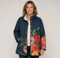 EMMA Vuokko quilted jacket in petrol blue poppy print, worn by a model